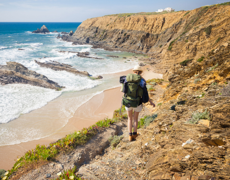 Woman hiking along the Portuguese coast