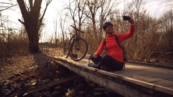 influencer taking pics on a bike trip